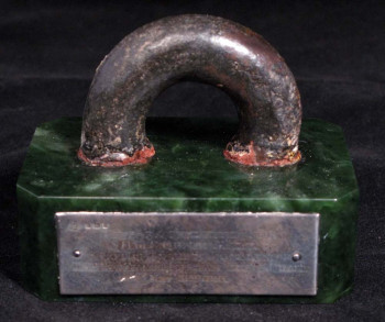 GBI-0005-Mounted-piece-of-ring-bolt-from-HMS-Queen-Mary-which-landed-on-the-quarterdeck-of-HMS-New-Zealand-during-the-Battle-of-Jutland-350x293.jpg